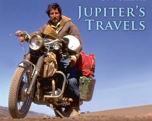 Ted Simon riding a Triumph Tiger 100 motorcycle.