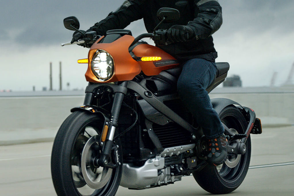 Harley-Davidson’s first venture into the electric motorcycle arena will finally arrive later this summer. The LiveWire first introduced back in 2014, is now available for pre-order with an August - September 2019 launch date. Earlier this year at the Consumer Electronics Show (CES) in Las Vegas, Harley-Davidson unveiled the base price $29,799 US, of the 2020 LiveWire. Seating the bike in the upper echelons of the brand's price range. According to Harley-Davidson, the company is anticipating that the release of their first EV motorcycle will reverse slowing sales and nosediving stock value by appealing to a new breed of rider - the 18-to-35-year-old demographic. Steep retail price aside, the LiveWire looks absolutely stunning with a futuristic design and a full-colour TFT display, which connects the riders smartphone to the new new H-D Connect app-based operating system. The system monitors the bike’s diagnostics, charge status, will provide turn-by-turn navigation and receives security alerts. Time will tell whether the zero-emissions bike thrusts the Milwaukee company into the electric motorcycle stratosphere successfully or not. The LiveWire's Electronic Chassis Control (ECC), manages cornering-enhanced Anti-lock Braking System (ABS), Traction Control System (TCS) and Drag-Torque Slip Control System (DSCS) by modulating torque available at the rear wheel. Located on the top of the gas tank is the onboard Level 1 charger and power cord which connects to any standard household outlet and get a full charge overnight. Using a stage-three supercharger connection, the batteries will charge from zero to 80 per cent capacity in approximately 40 minutes. With the H-D CONNECT SERVICE, you can connect remotely through your smartphone to receive bike vitals like battery charge status, see its location on a map, and get security alerts if it’s been bumped, tampered with or moved. The LiveWire™ motorcycle features a high-voltage battery (or RESS; Rechargeable Energy Storage System) composed of lithium-ion cells surrounded by a finned, cast-aluminum housing. The high-voltage battery provides 225 km of city range or 142 km of combined stop-and-go and highway range Harley Davidson claims a 0-60 mph time of 3.5 seconds, with instant power the moment the throttle is twisted. The LiveWire comes outfitted with an adjustable suspension, Brembo brakes with ABS and traction control. Custom designed 180mm rear, and 120mm front Michelin Scorcher Sports tires.