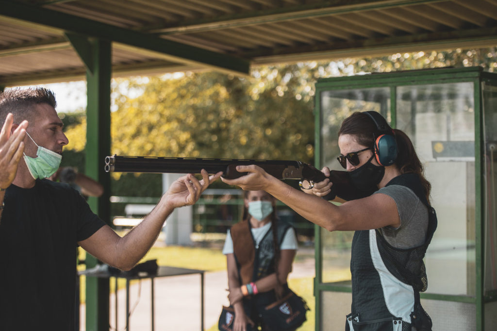 female-getting-shooting-instruction-photo by-andrea-caiola-courtesy-WMBootcamp