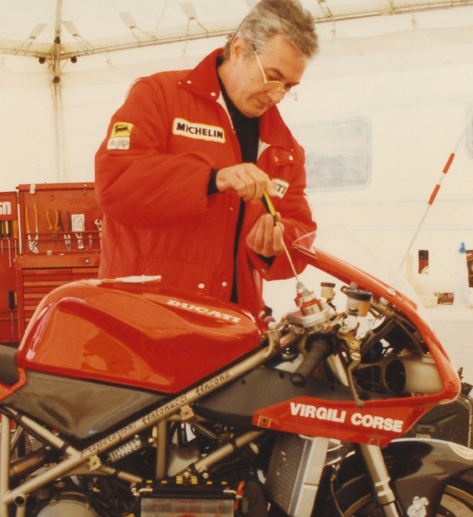 Massimo Tamburini working on a Ducati race bike.