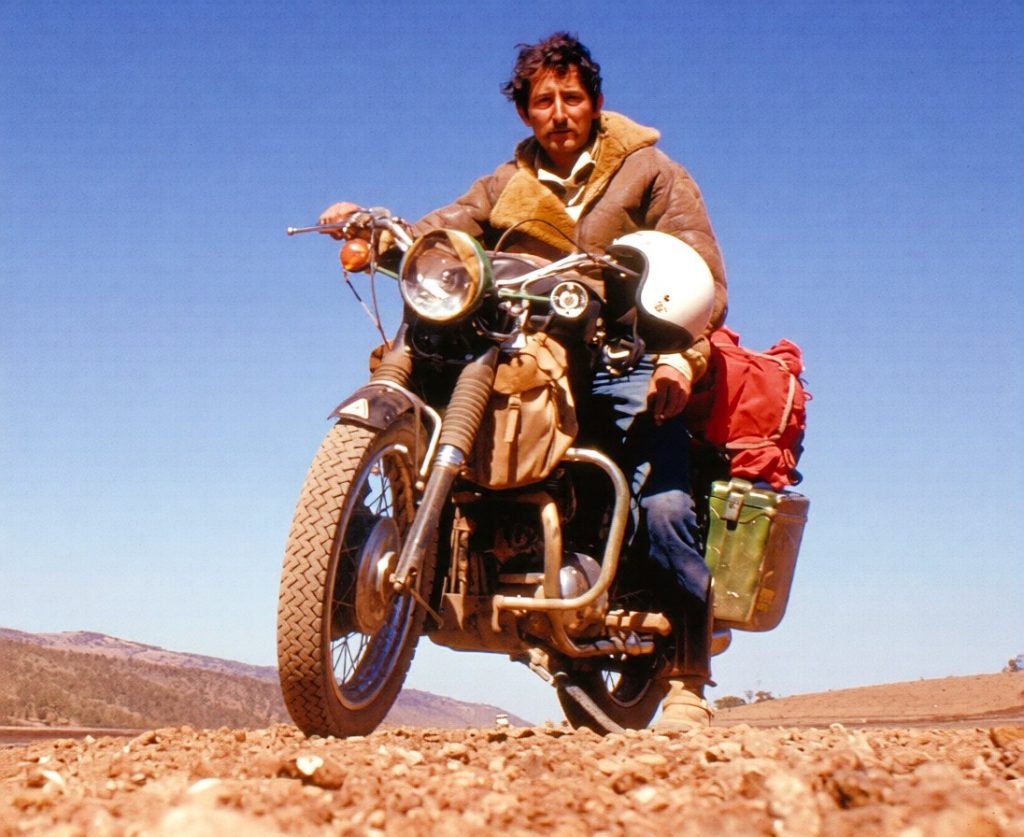 Ted Simon in the desert, on his Triumph Tiger 100 motorcycle.