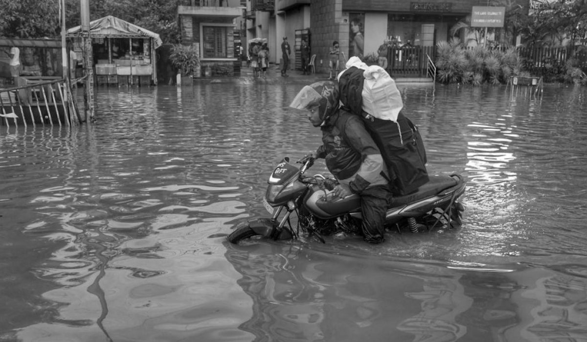 man-driving-on-a-motorcycle-through-the-flooding-21960690/