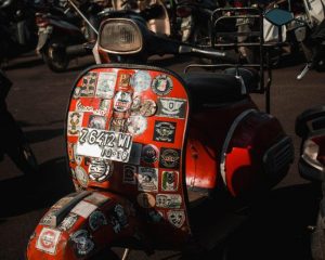 close up vintage vespa scooters with stickers accessories luggage rally gathering detail