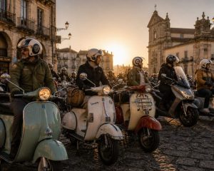 Vintage Vespa and Lambretta scooters gathered for a European scooter rally in a historic town square.