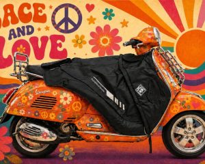 Vespa scooter with a black leg cover for warmer, more comfortable riding in cool and windy weather.